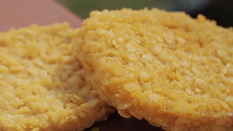 delicious fresh crispy chicken nuggets on a dark concrete background. unhealthy food, fast food. high quality 4k footage