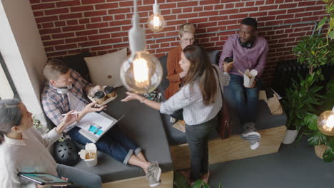 diverse business people enjoying lunch break eating together enjoying relaxing office brainstorming discussing creative ideas friends collaborating in relaxed cafe meeting top view