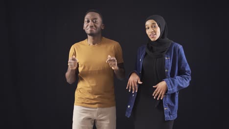 African-young-man-and-woman-dancing.