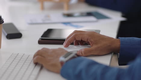 close up hands typing businessman using computer browsing web searching online brainstorming working in office