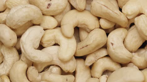 smooth camera movement over a handful of cashew nuts.