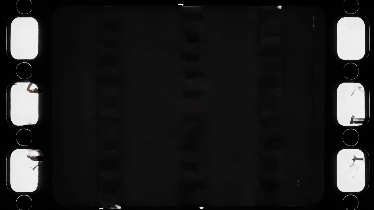 Vintage video filmstrip with a top-down angle, showing black and white checkered patterns