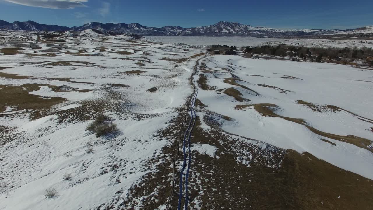 A flight over a snow covered valley