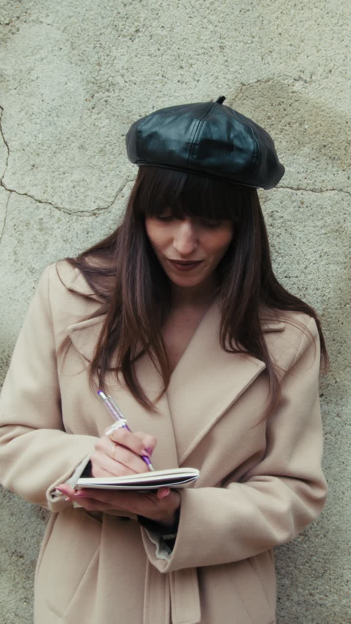 Happy Woman Outdoor Writing Ideas On A Notebook With A Pen