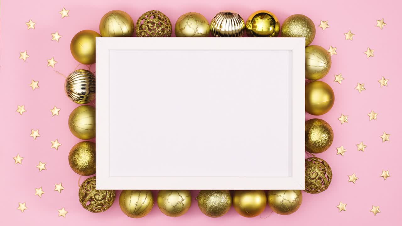 White empty frame for Christmas text and surrounded with gold ornaments. Stop motion