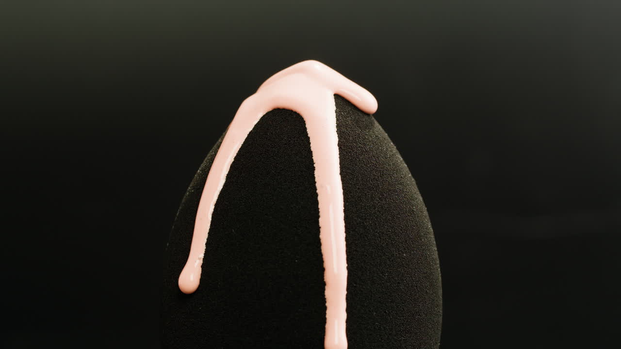 Makeup Sponge with Dropping Pink Liquid