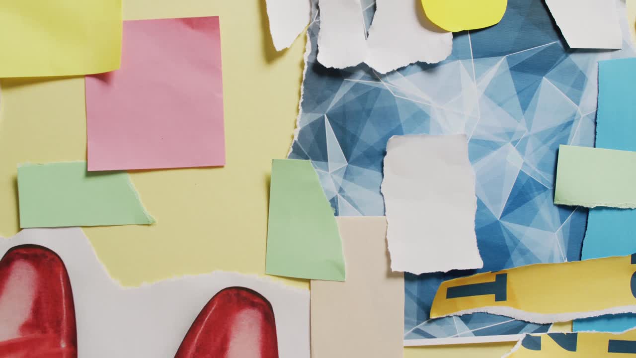 Video of close up of collage of scraps of paper on yellow background