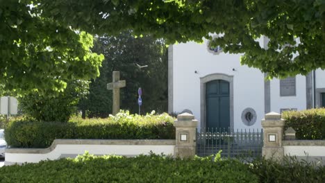 a stone cross and a church.