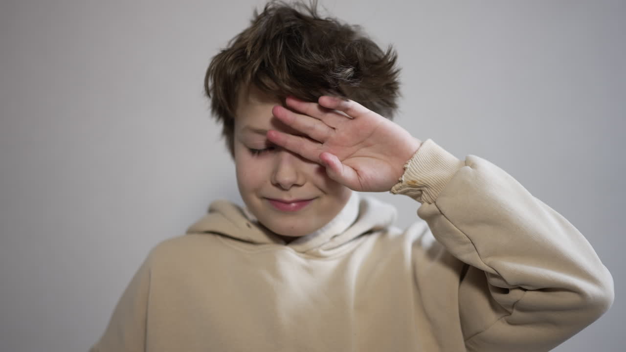 Boy expressing different emotions