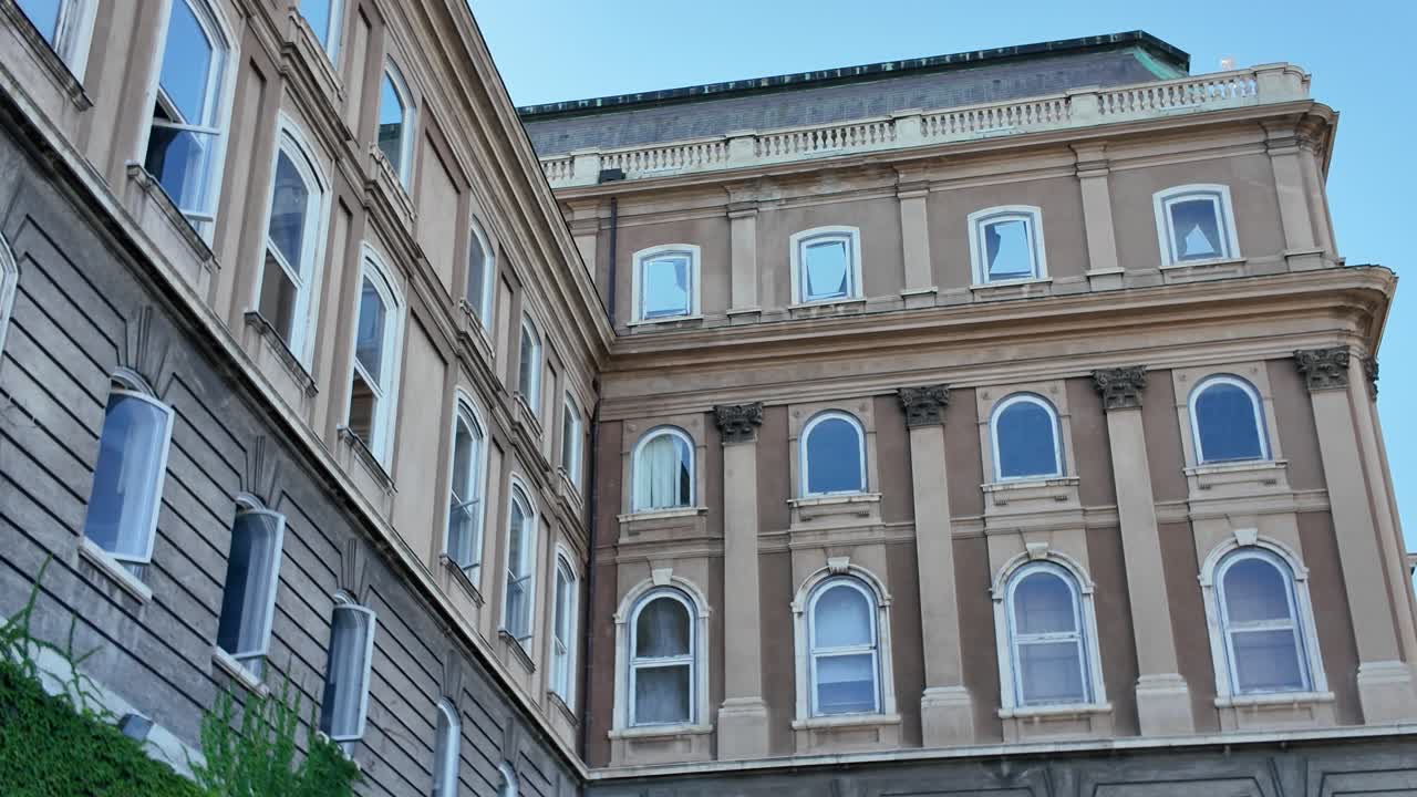 Buda Castle architecture with ivy covered walls and statue in Budapest Hungary