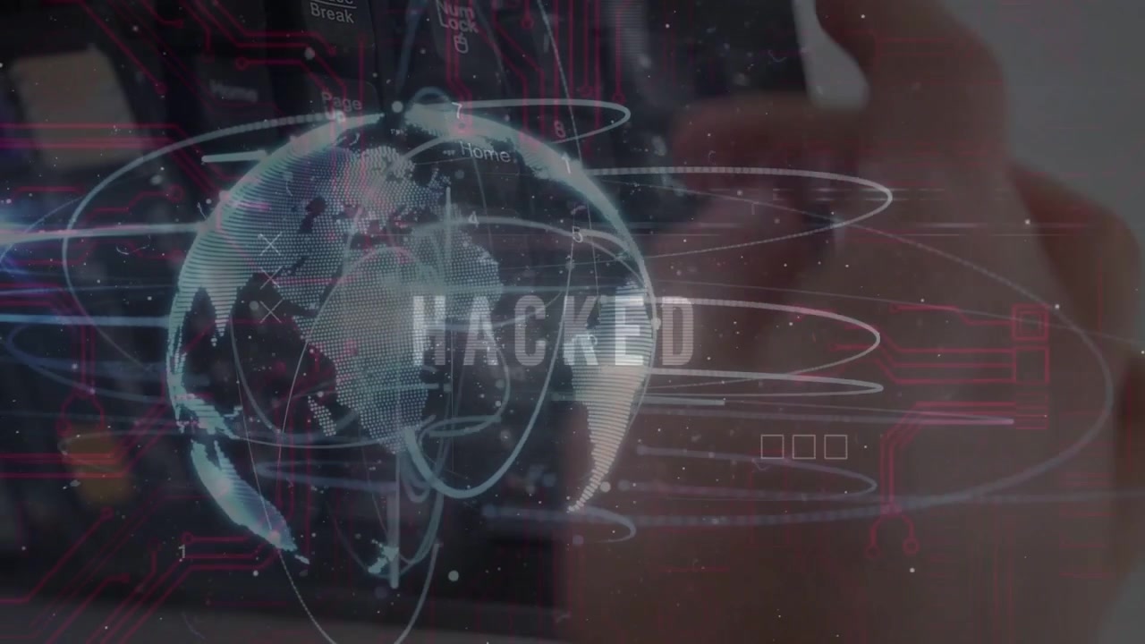 Fingers pressing keys starting globe overlay, HUD rings orbiting, HACKED pulsing showing breach