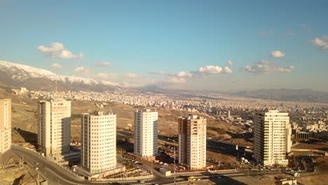 aerial-fly-drone-shot-over-Tehran-city-of-light-air-pollution-and-revolution-people-unrest-arrest-by-police-guard-in-woman-life-freedom-movement-protest-today-tonight-view-landscape-of-tower-people