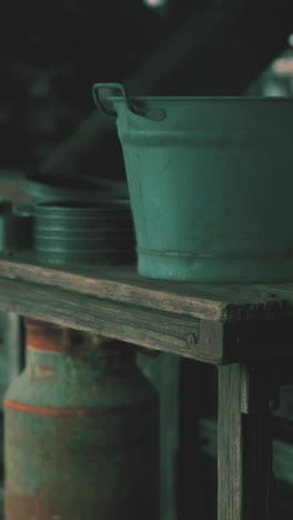 vintage metal bucket and containers on a rustic wooden table