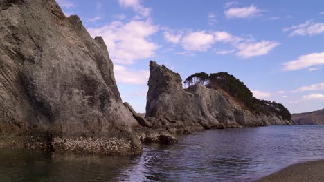 Calm-and-beautiful-scenery-of-tall-cliffs-at-Jodagahama-beach-in-Japan