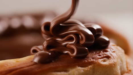 rich chocolate drizzle over golden pastry