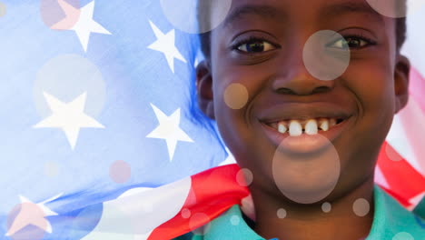 animation of white circles moving over african american boy holding american flag