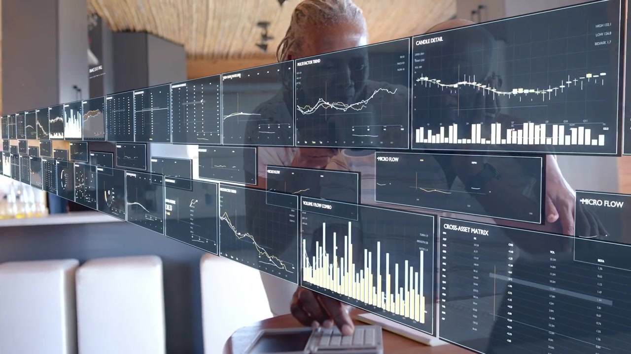 Senior couple using laptop in kitchen, initiating AR finance dashboards sliding and updating charts