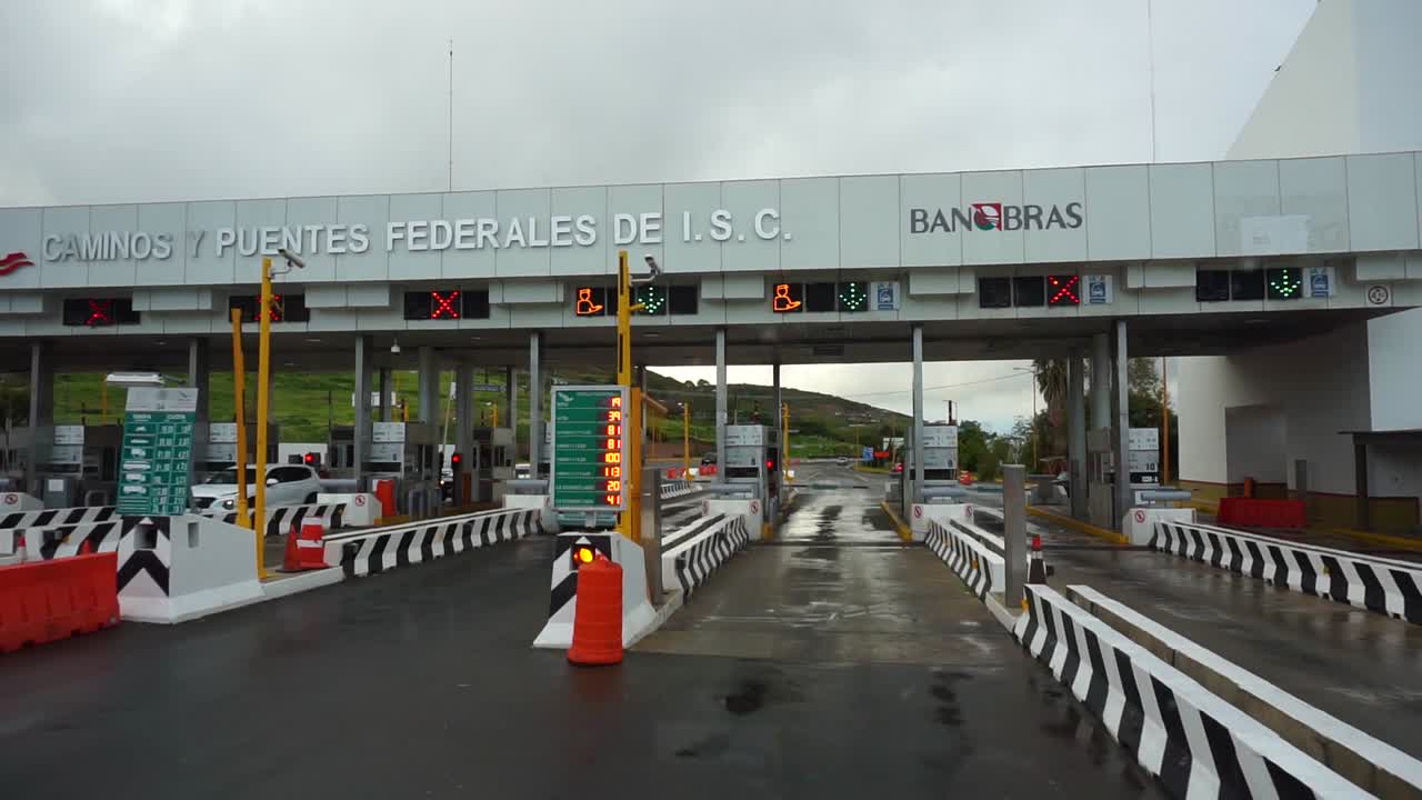 Approaching Federal Highway One Toll Booth outside of Tijuana, Mexico - POV shot