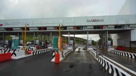 approaching federal highway one toll booth outside of tijuana, mexico - pov shot