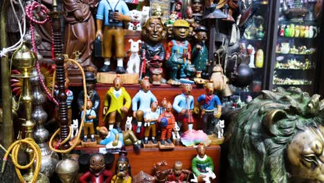 various toys and figurines on display in a shop