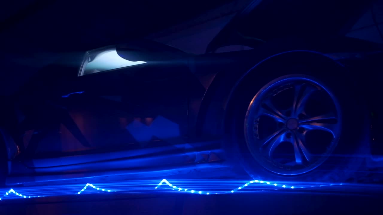 Dark Night Sports Car Under Blue Light