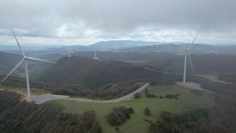 aerial footage of a wind farm full of windmills in mexico