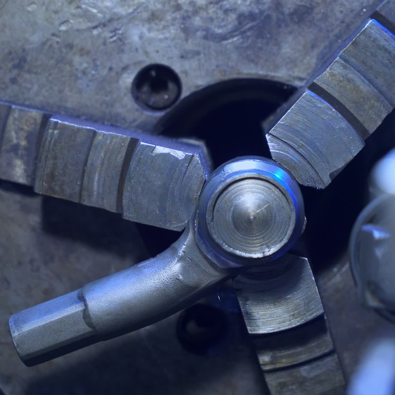 Rotating mechanism in turning lathe to fasten and grind details. Mechanical equipment for turner's workshop. Close up