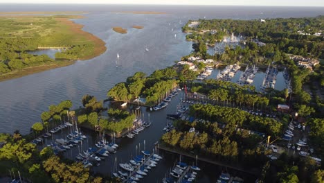 Aerial-birds-eye-shot-of-river-mouth-of-Rio-de-la-Plata-and-Yacht-Club-at-sunset-in-Buenos-Aires