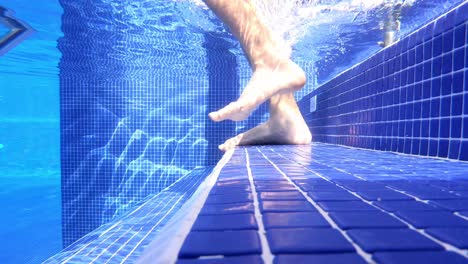 Walking-down-the-stairs-inside-the-big-luxury-pool