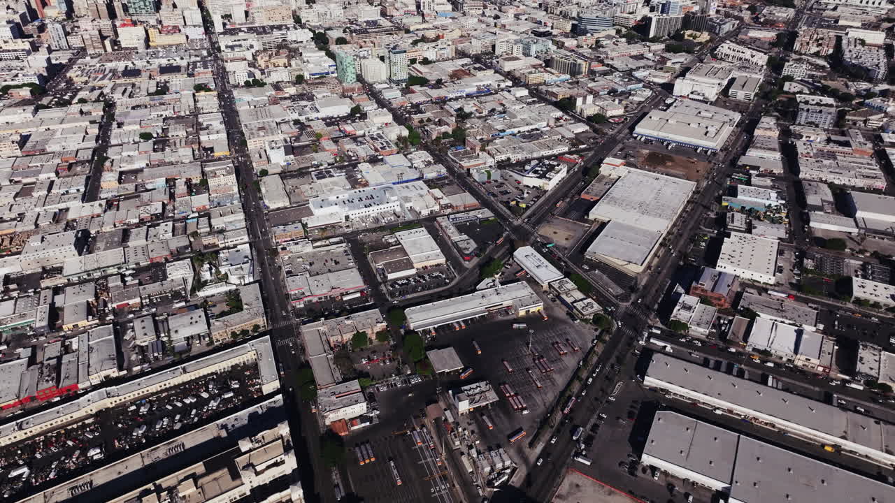 Aerial view of a sprawling urban landscape with numerous buildings and intersecting roads