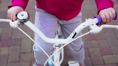 little girl riding her colorful bicycle in the backyard 4k