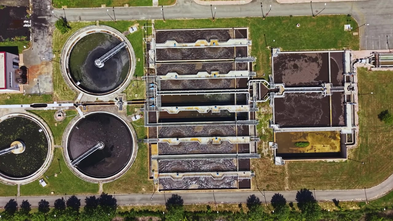 Monitoring systems oversee infrastructure for sustainable management. Advanced treatment plant integrates clear design with smart city operations and sustainability goals