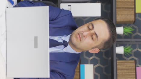 vertical video of businessman falling asleep.