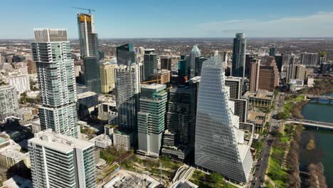 aerial shot of downtown austin, tx with the colorado river in frame