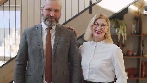 portrait of cheerful senior male and female colleagues