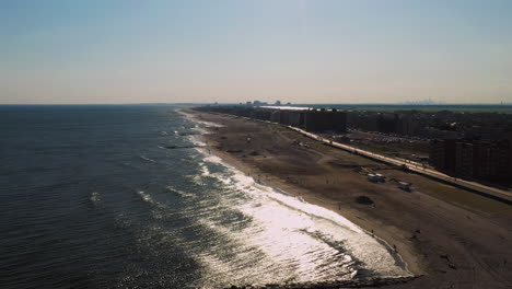 left-orbit-turning-towards-the-shore-with-setting-sun-glistening-on-the-ocean-below