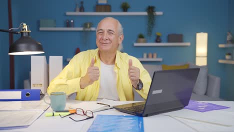 home office worker old man dances looking at camera.