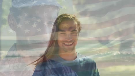 animation of flag of united states of america over soldier and happy caucasian man on beach
