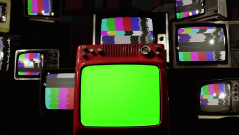 vintage television sets with color bars and retro tv with green screen. zoom in.