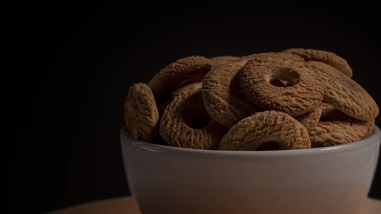 Ring Coconut biscuits served on a bowl. Brazilian little donuts. Selective focus in a front view