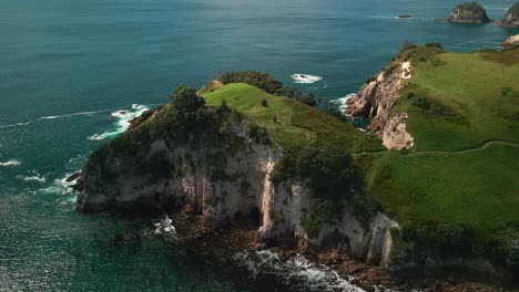 aerial drone shot of scenic viewpoint in hahei new zealand along the east coast