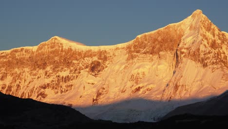 pan view of mount san lorenzo in southern patagonia with vibrant orange light over glaciers. perito moreno nationa park.