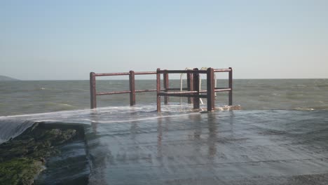 Rusty-platform-on-Portmarnock-beach-for-winter-sea-swimming-in-Dublin,-Ireland