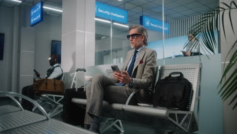 businessman waiting at airport security