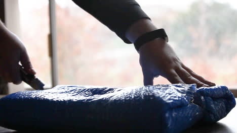 smooth cutting action using cutting knife to open bubble wrapped package