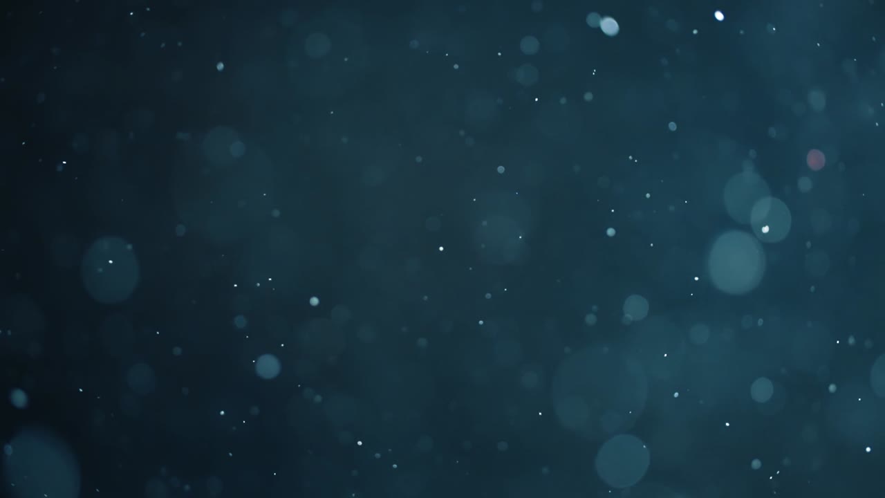 bokeh de partículas abstractas flotantes sobre fondo oscuro
