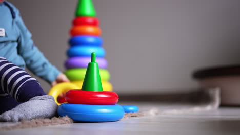 baby playing with stacking rings