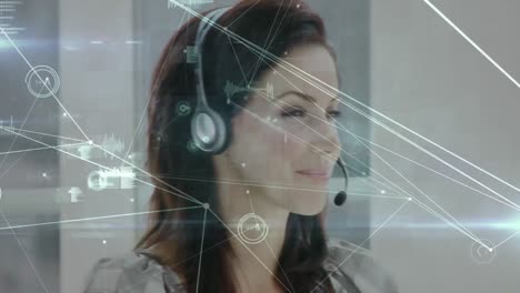 Animation-of-networks-of-connections-over-businesswoman-using-phone-headsets