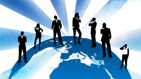 business people silhouettes standing on the planet