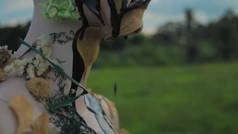 nature-inspired art installation on mannequin